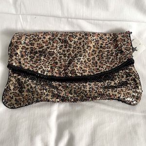 Fold over sequenced handbag